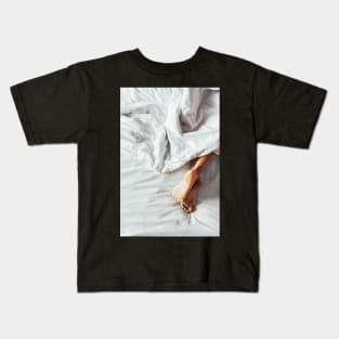 Woman's Feet on White Bedding Kids T-Shirt